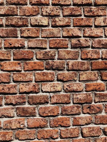 The boundary wall separating my house and the one behind is crumbling