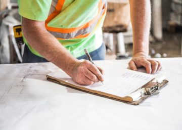 worker-filling-paperwork